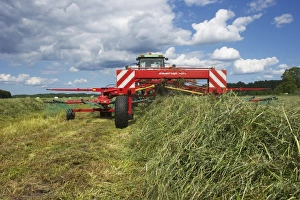 Cultivate Prints: Silage crop, tractor with double turner, turning cut grass for silage, Sweden, august