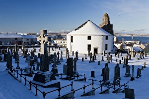 Religions Prints: Snow covered cemetery and round church