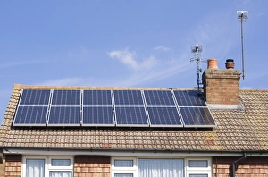 Supply Prints: Solar panels for heating domestic hot water, on roof of house, Surrey, England, September