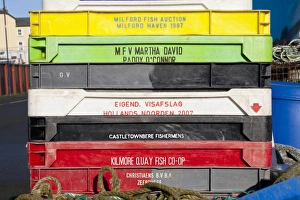 Stacked Prints: Stack of plastic fish boxes on quayside, Aberystwyth, Ceredigion, Wales, January