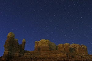 Erosion Prints: Stars over eroded rock formation at night, Bluff, Utah, U. S. A. may