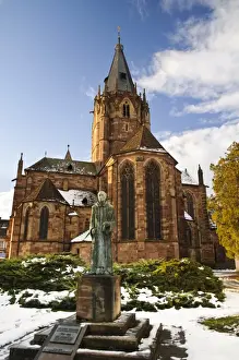 Religions Prints: Statue of Benedictine monk and Roman Catholic church in snow, St. Peter and St