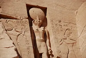 Sculptures Prints: Statue of falcon-headed sun god Ra-Horakhty decorating facade of temple