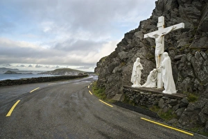 Statue with Jesus on Crucifix with Mary and Saint John, beside coastal road, Coumeenole South, Slea Head