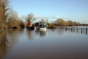 Flood Prints: Stranded school bus in flooded rural road