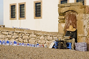 Streets Prints: Street painter in coastal city, Essaouira, Morocco, february