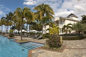 Holidays Prints: Swimming pool with palm trees and hotel building