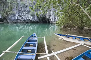 Canoe Prints: Tourist boats outside cave entrance to subterranea river
