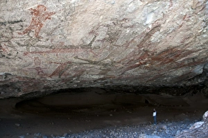Cave Prints: Tourist looking at San Borjitas cave paintings