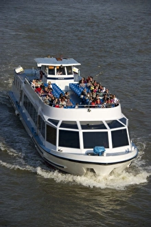 Holidays Prints: Tourist sightseeing boat on city river, River Thames, London, England, april