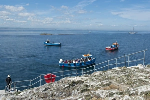 Holidays Prints: Tourists on boats arriving at island