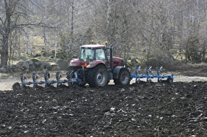 Plough Prints: Tractor ploughing with front and rear mounted plough, Vastergotland, Sweden, spring