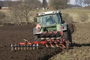 Furrows Prints: Tractor pulling four furrow reversible plough and small harrow