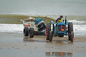 Trailer Prints: Tractor and trailer landing crab fishing boat on beach, Cromer, Norfolk, England, august