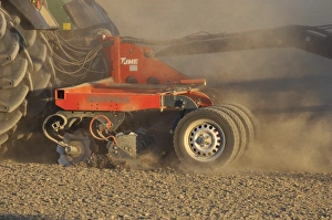 Prepare Prints: Tractor with Tume Cultipack disk harrows, field seedbed preparation, Sweden, may