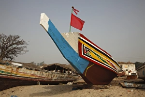Gambia Prints: Traditional fishing boat on beach, Gambia, january