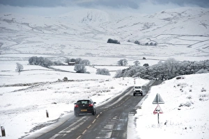 Cars Prints: Traffic on road in snowy weather conditions