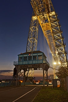Transporter bridge over river at twilight, Newport Transporter Bridge, River Usk, Newport, South Wales, Wales