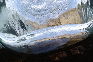 Wave Prints: Underwater view of wave breaking on exposed rocky shore