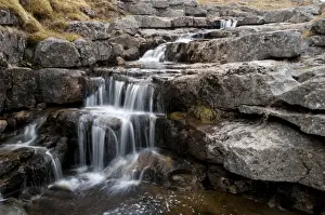 Limestone Prints: Upland stream cascading over limestone pavement before flowing into chasm