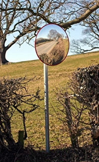 Entrances Prints: Use of convex mirror to see road traffic from farm entrance, North Wales, march