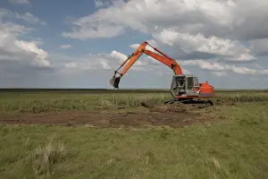 Maintenance Prints: Using a digger for maintenance work on Deepdale Marsh north Norfolk
