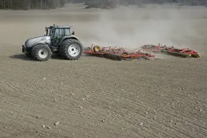 Valtra tractor with Vaderstad NZA-800 and Vaderstad RS-820 harrows and rollers, cultivating arable field, Sweden, april