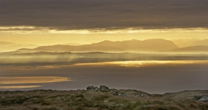 Distance Prints: View across bay towards distant hills at sunrise