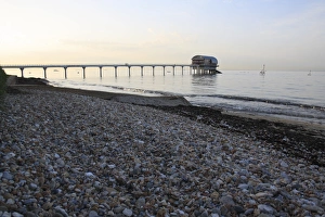 Life Boat Prints: View of beach and lifeboat boathouse at sunset