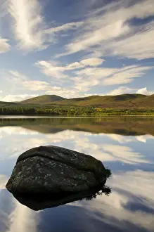 Caledonian Forests Prints: View of blue sky, clouds and rock reflected in still water of freshwater loch