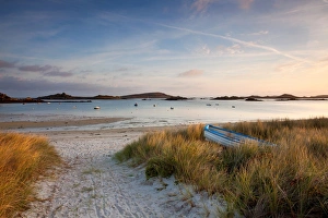 Shore Prints: View of boat on beach and moored in bay at sunrise