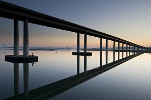 Sun Rise Prints: View of bridge reflected in estuary at dawn
