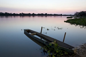 Canoe Prints: View of canoe and river at sunset, Paraguay River, Pantanal, Mato Grosso, Brazil