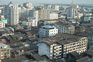Myanmar Prints: View across city rooftops (from Traders Hotel) towards river, Yangon, Myanmar, March