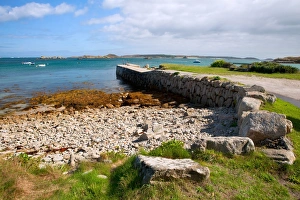 Quay Prints: View of coast and quay at low tide, looking across Porth Green towards St
