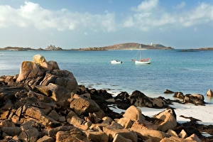 Moored Prints: View of coast with two small boats moored