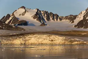 North Polar Prints: View of coastal glacier terminus and mountains in evening light