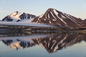North Polar Prints: View of coastal mountains in fjord in evening light