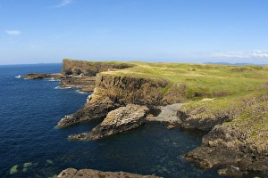 View of coastline with cliffs and columnar basalt rocks, Staffa, Inner Hebrides, Scotland, july