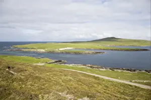 Coast Line Prints: View of coastline with distant wardens house and ferry crossing