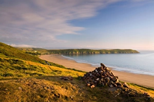 Trending: View of coastline with headland at sunset