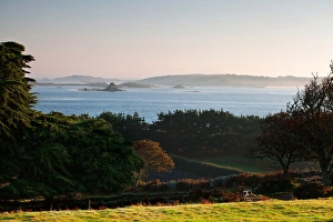 Mists Prints: View of coastline with lifting sea mist at at sunrise