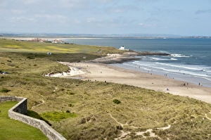 Bamburgh Prints: View of coastline with sand dunes and beach, Bamburgh, Northumberland, England, july