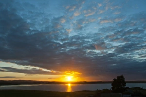 Skies Prints: View of coastline at sunset, Bamburgh, Northumberland, England, july