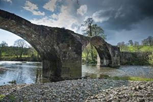 Disused Prints: View of disused packhorse bridge over river