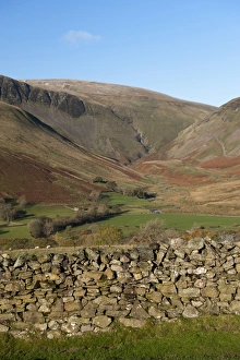 Falls Prints: View of drystone wall and farmland in fell valley, with waterfall in distance