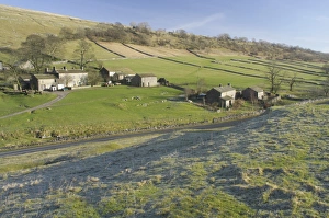 View of farm, stone buildings and road in river valley, frost in foreground, Yockenthwaite, Langstrothdale