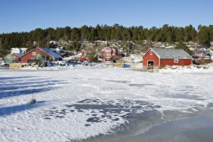 Freeze Prints: View of fishing village with boathouses in ice and snow
