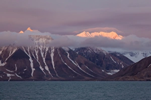 View of fjord coastline and mountains at sunset, Hornsund, Spitsbergen, Svalbard, August