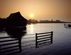 Centres Prints: View of floating vistor centre silhouetted at sunset